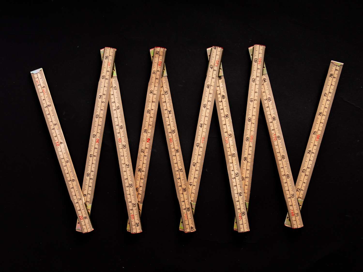 Folding ruler on a black background