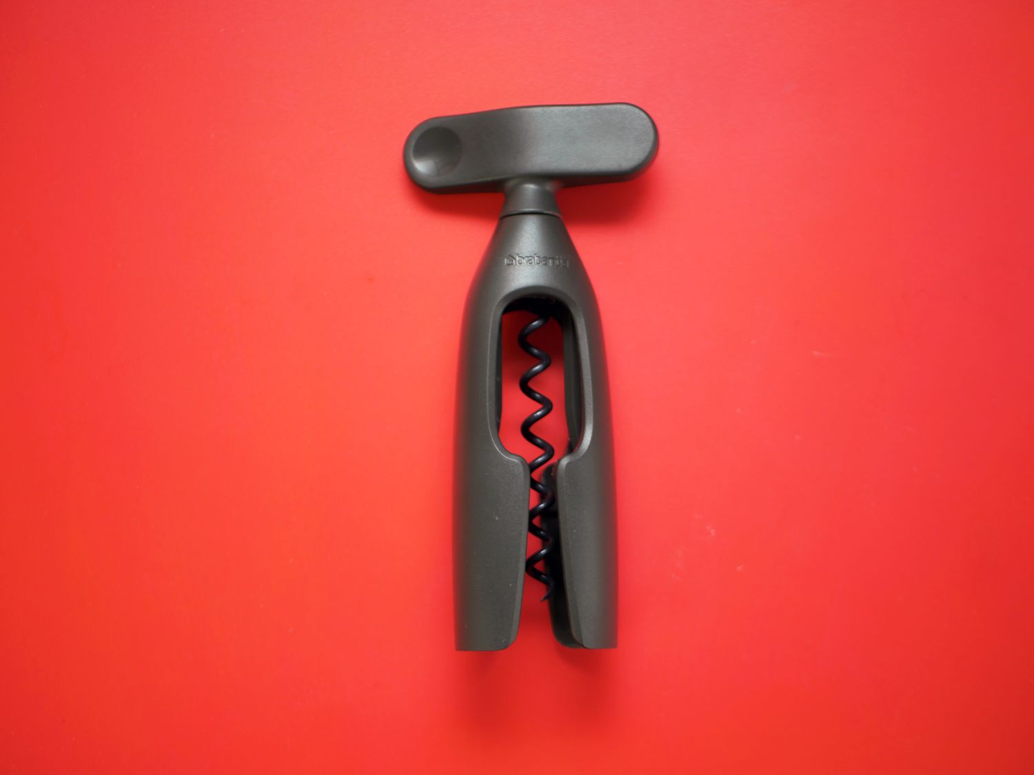 Brabantia wine opener on red surface