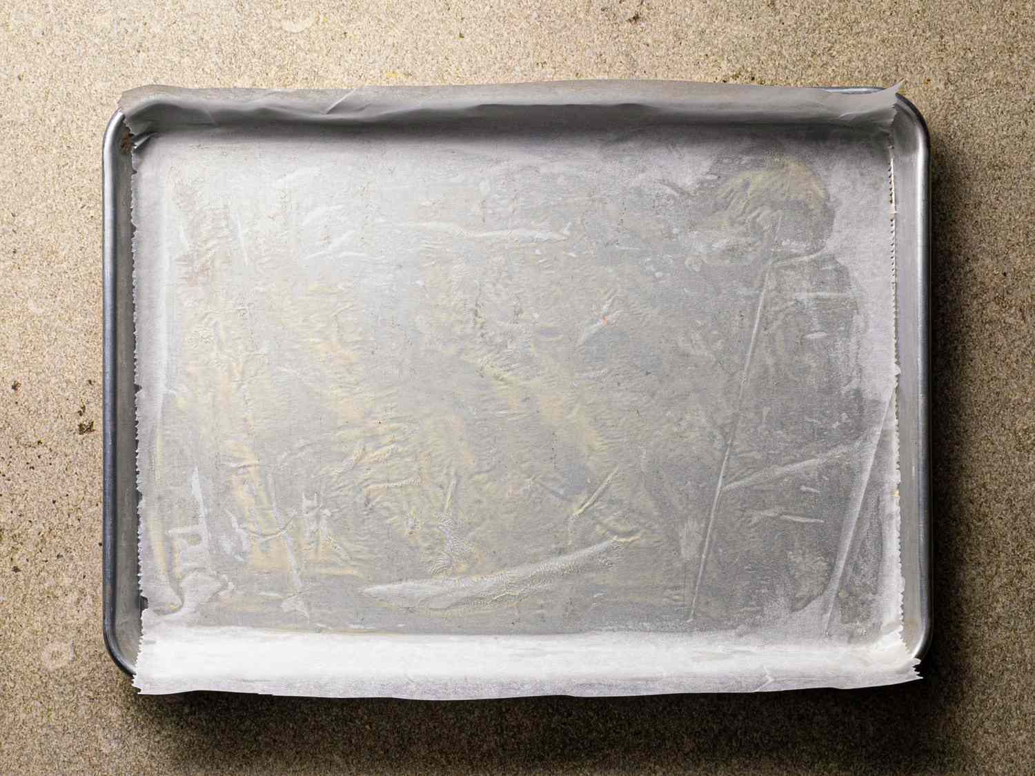 Parchment paper lining a baking sheet