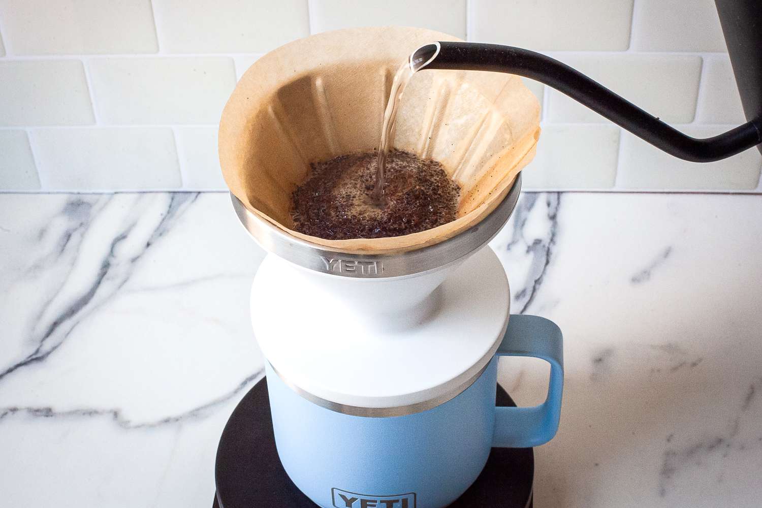 A kettle pouring water over the Yeti Rambler Pour-Over