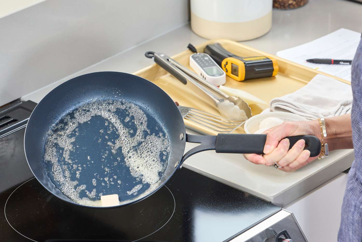 Butter is melted in the OXO Obsidian 10 Inch Pre-Seasoned Carbon Steel Frying Pan