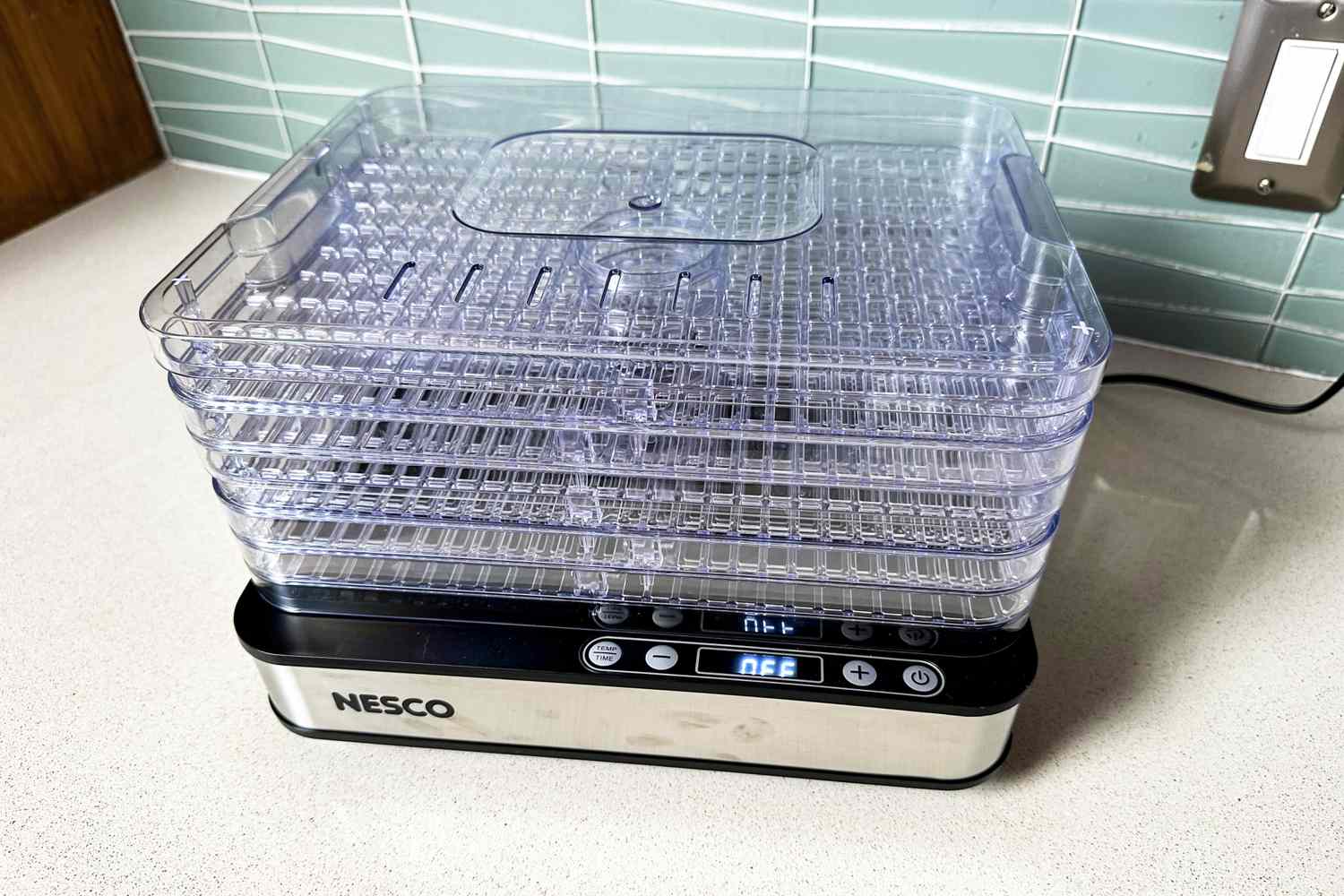 Nesco Digital 5 Rectangular Dehydrator with clear stackable trays on a kitchen counter