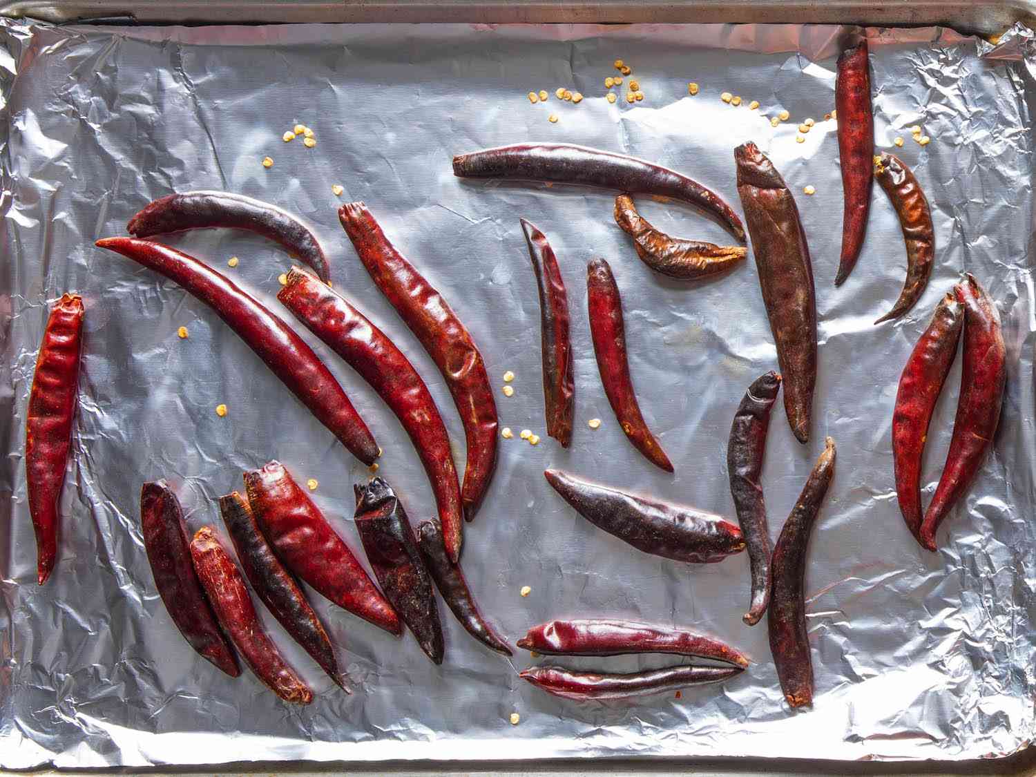 Dried spur chiles on a foil-lined baking sheet, broiled until lightly charred in spots.