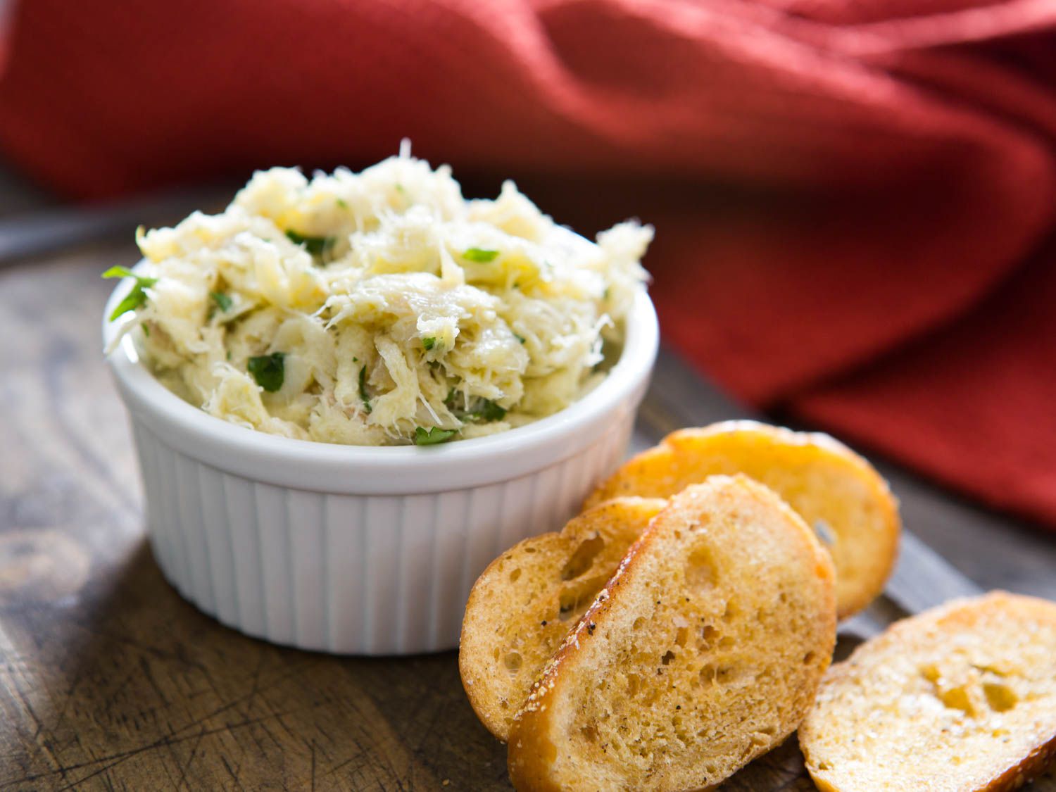 The salt cod brandade in a ramekin with toasted baguette toasts.
