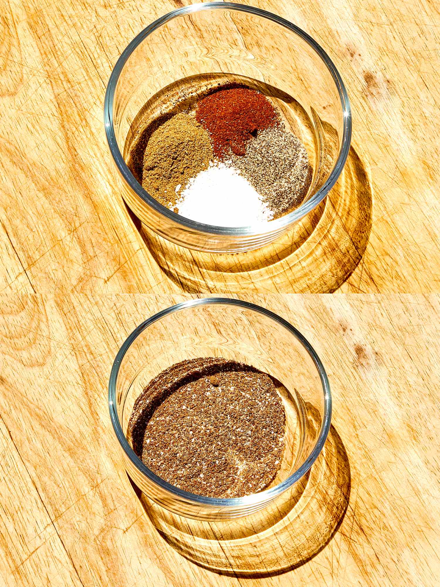 Two glass bowls on a table the top bowl contains spices unblended and the bottom bowl shows the spices mixed together