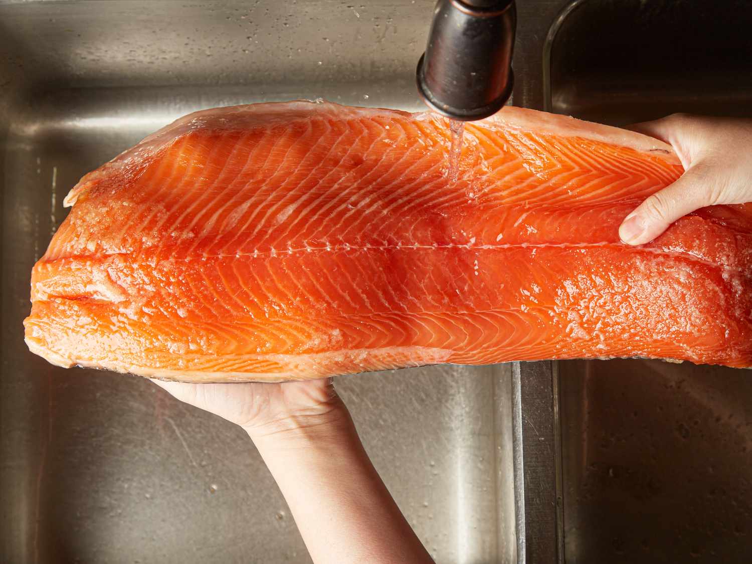 Overhead view of washing salmon