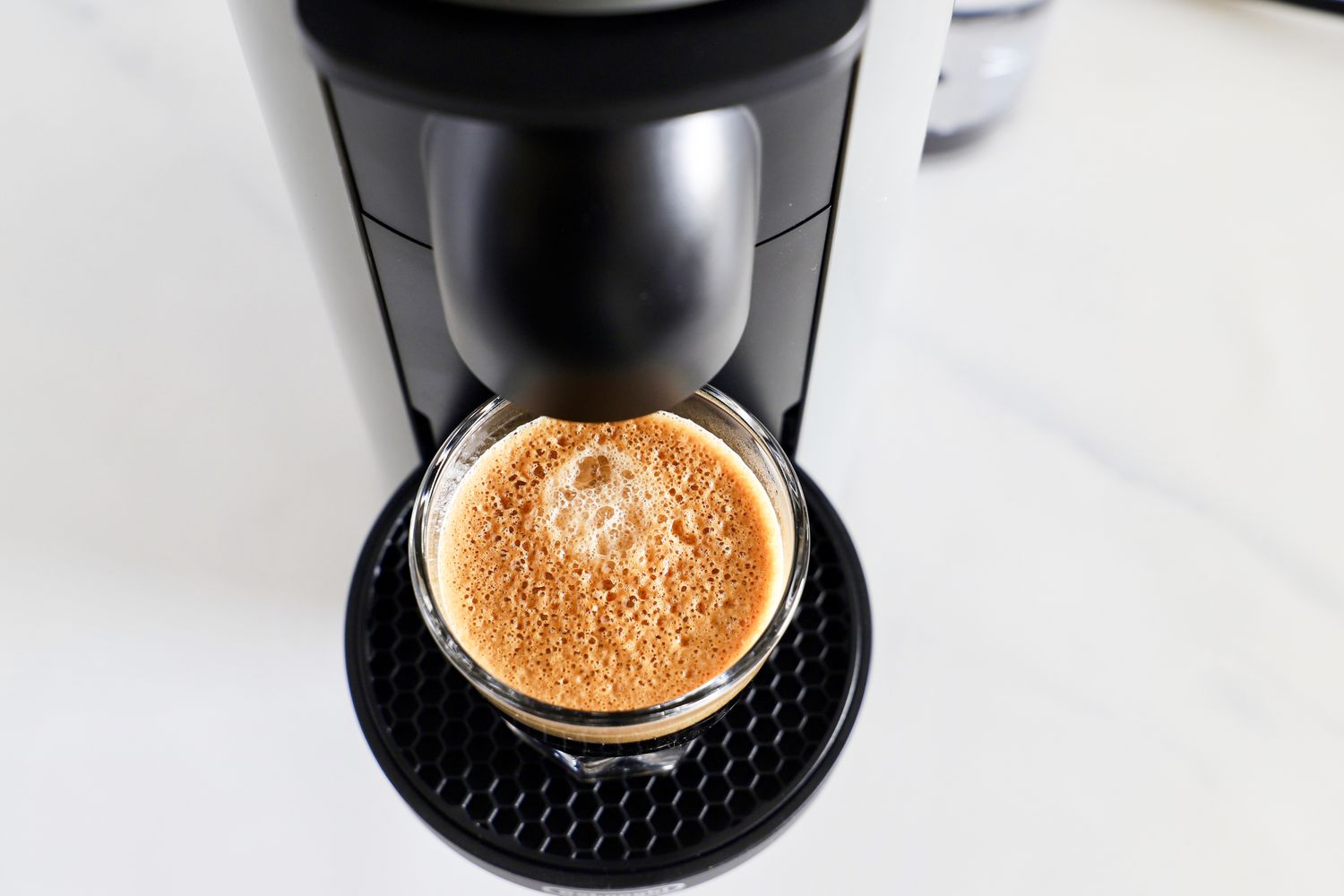 A cup of espresso on the Nespresso VertuoPlus Coffee and Espresso Machine by De'Longhi