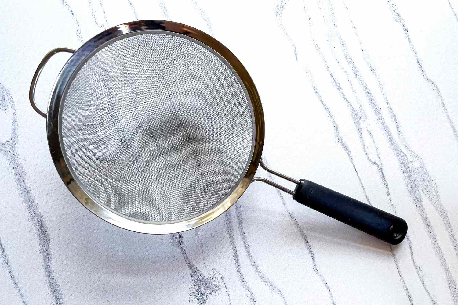 OXO Good Grips 8-Inch Double Rod Strainer on a marbled surface