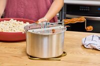 The Wabash Valley Farms Original Whirley-Pop Popcorn Popper on a table