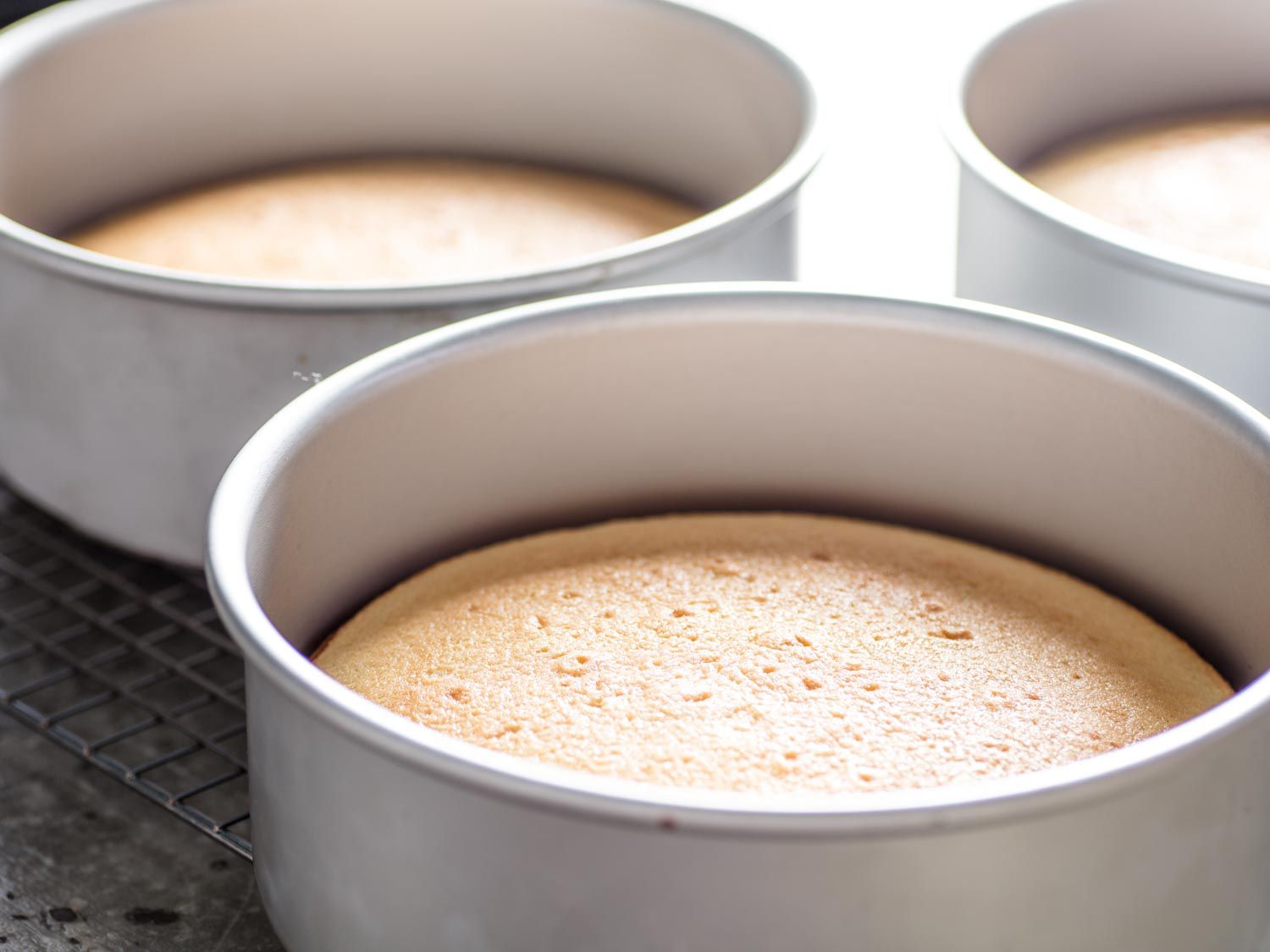 Layers for the butter cake resting in pans. 