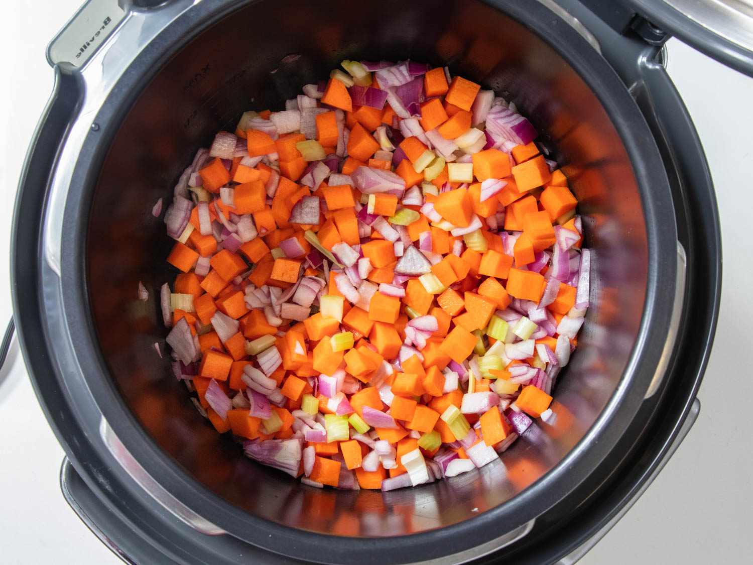 Chopped vegetables for ribollita in the pot of a pressure cooker