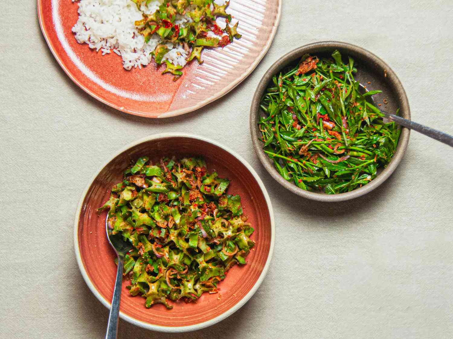 Overhead view of three different stylings of kerabu