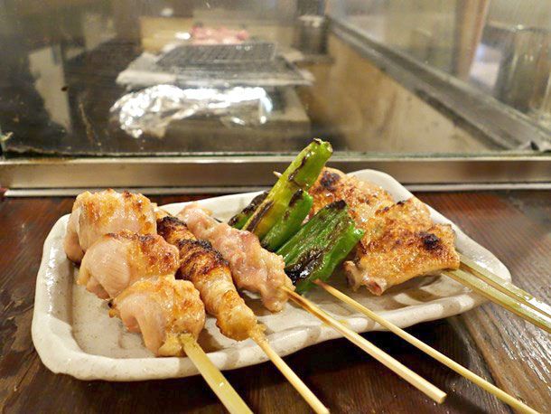 A plate of yakitori (assorted skewers) hot off the grill at Hajimeya