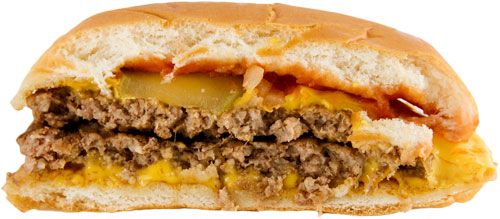 A McDonald's double cheeseburger showing two patties and two slices of cheese. 