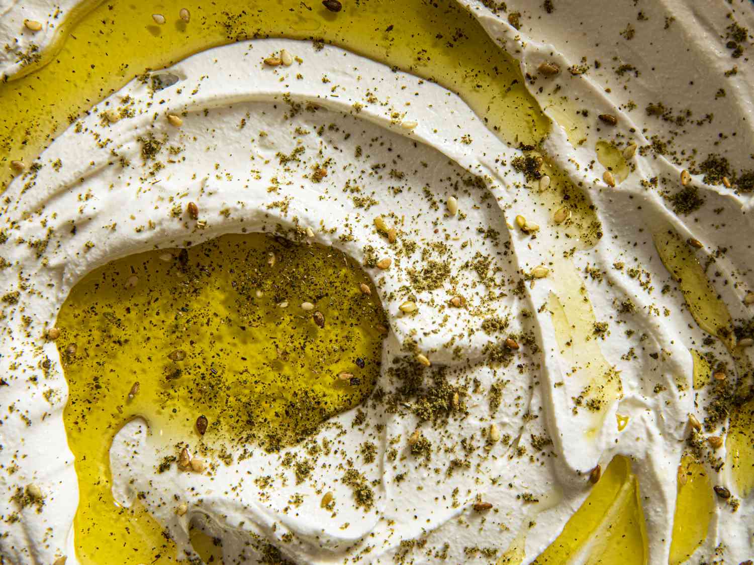 Detail shot of swirled labneh, topped with oil and za'atar