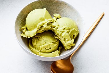 Overhead view of three scoops of avocado ice cream