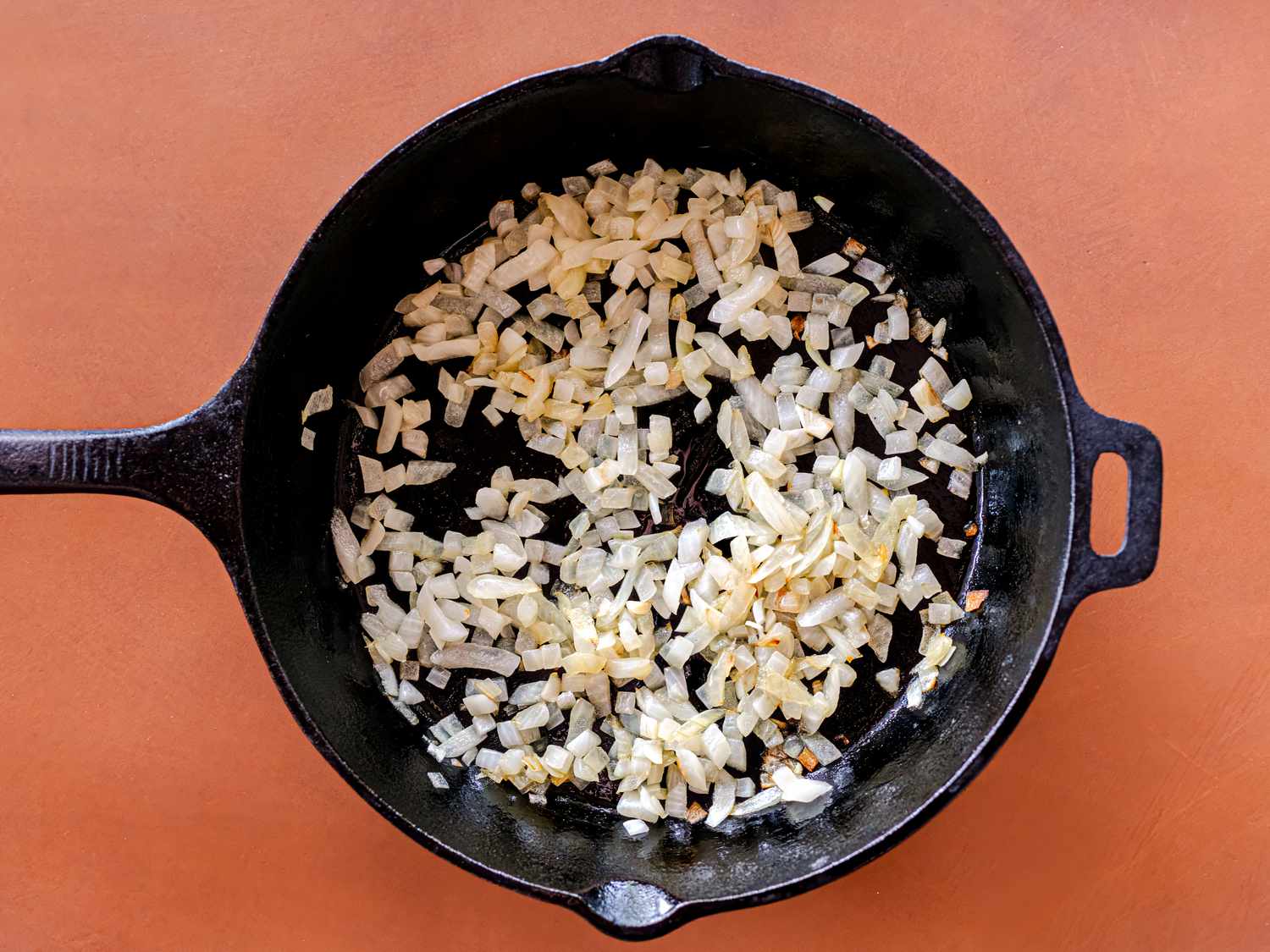Overhead view of onions cooking