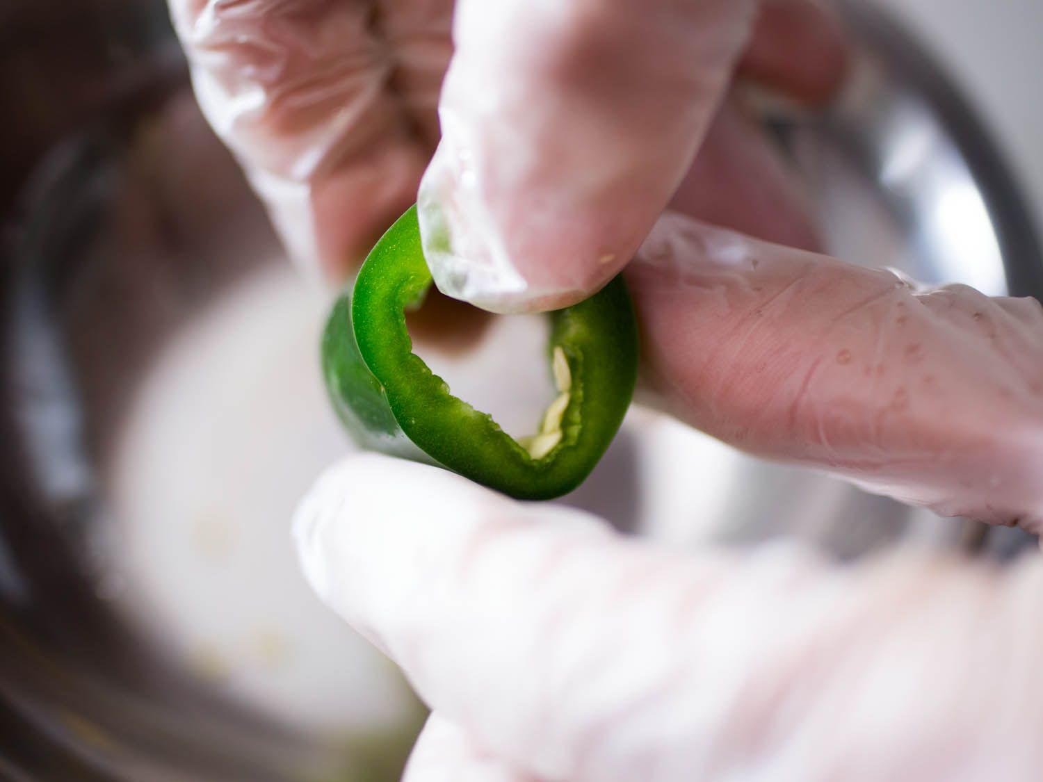 A cored ring of jalapeño ready for fillling.