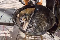 An overhead view of an opened SNS Grills Slow 'N Sear Original 22-Inch Kettle Grill