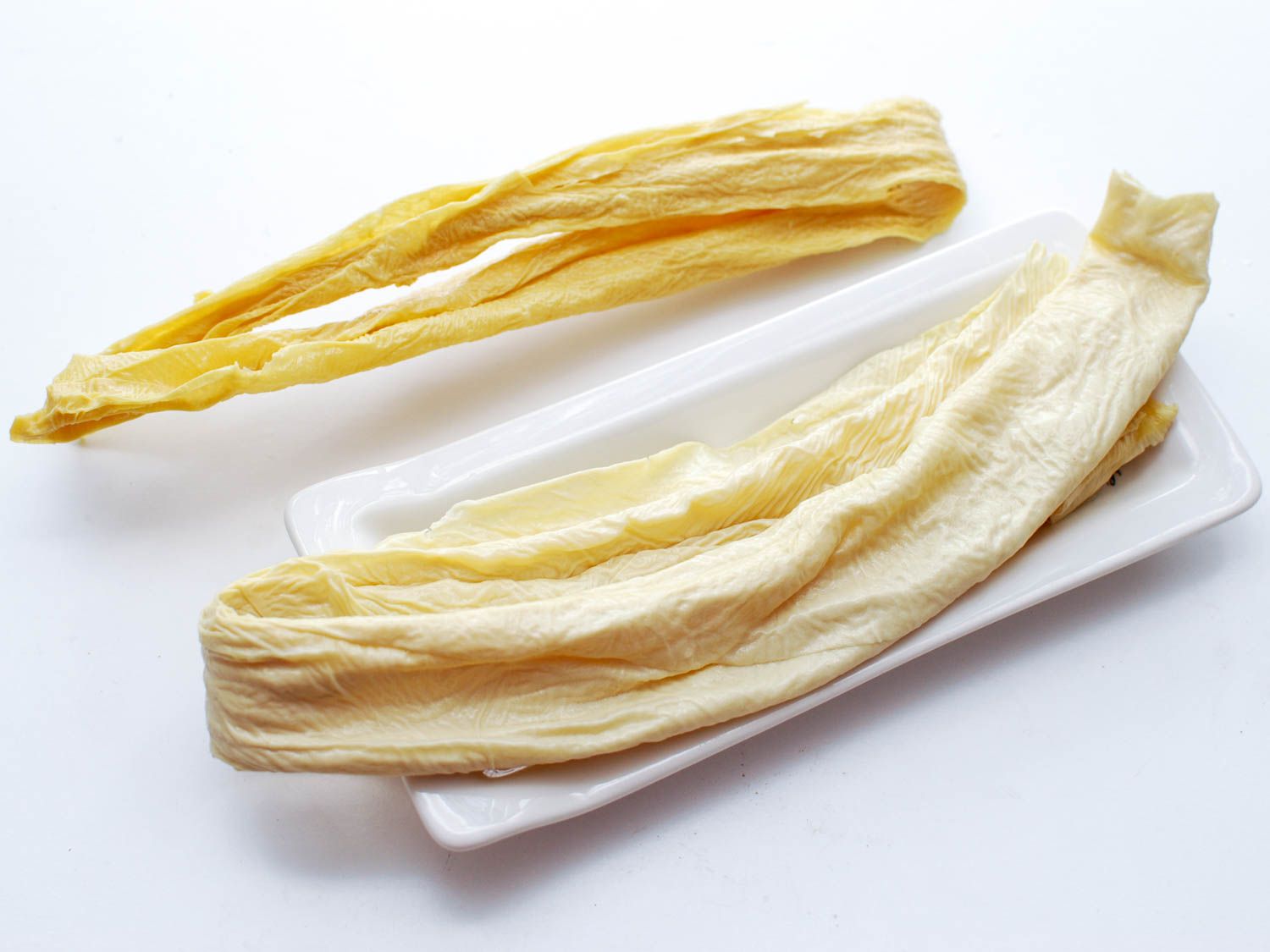 Pieces of dried yuba, the skin that forms on hot soy milk while making tofu.