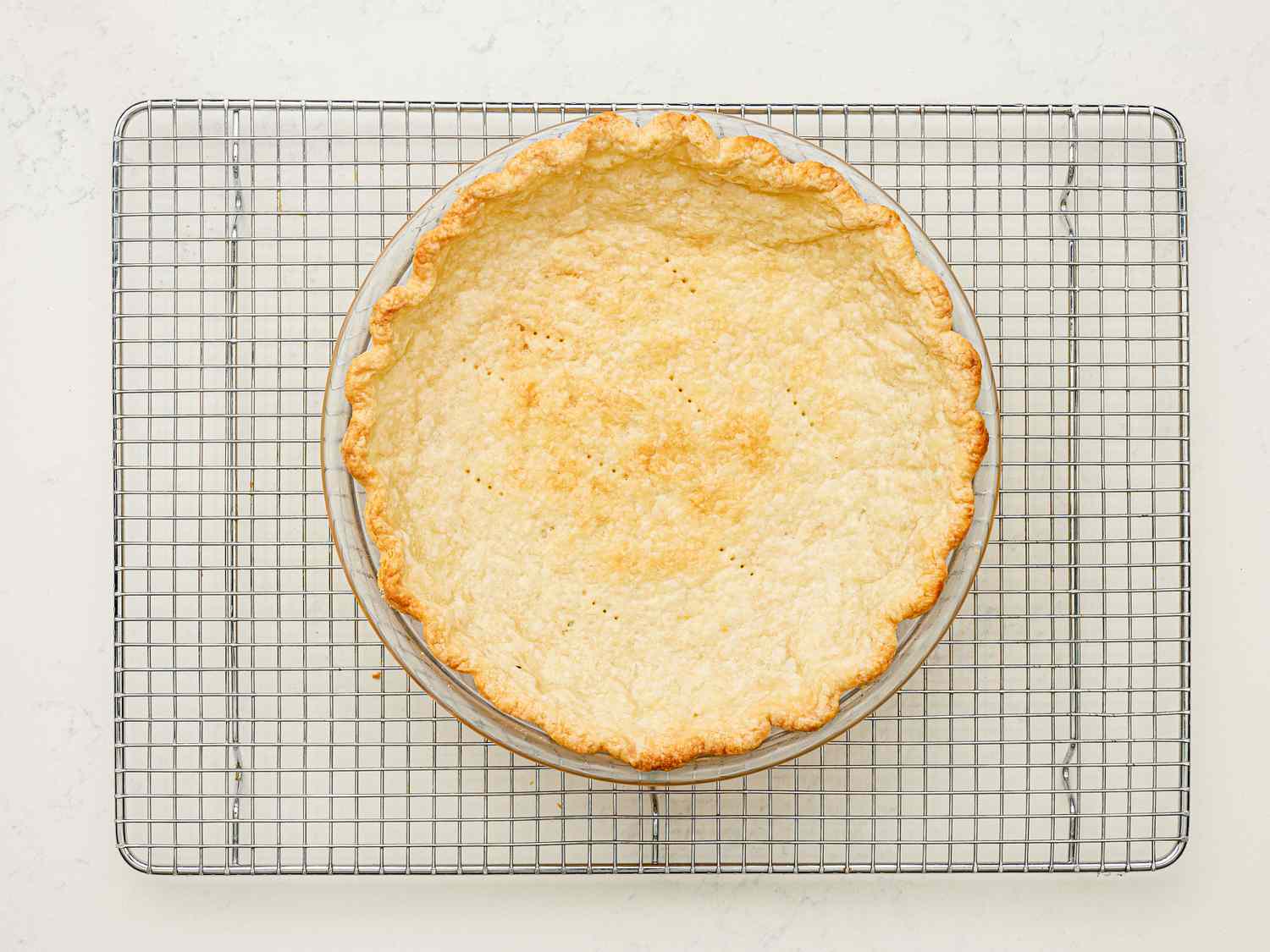 Cooked pie crust cooling.