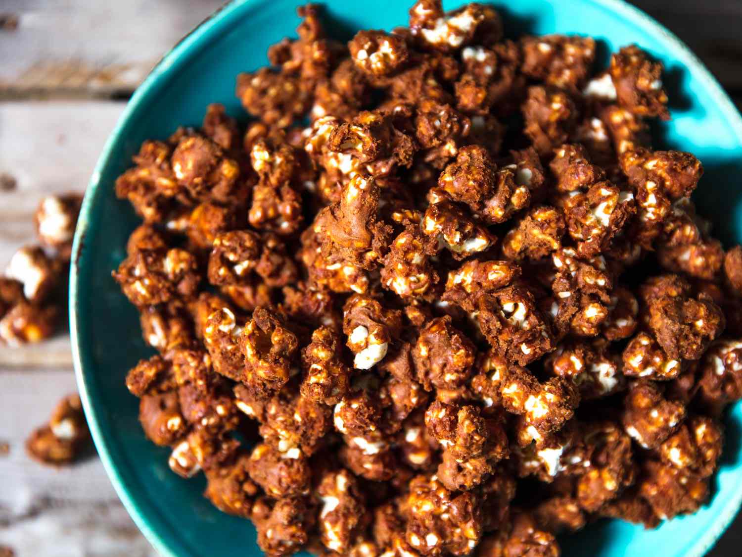 Overhead closeup of a bowl of crispy chocolate popcorn.