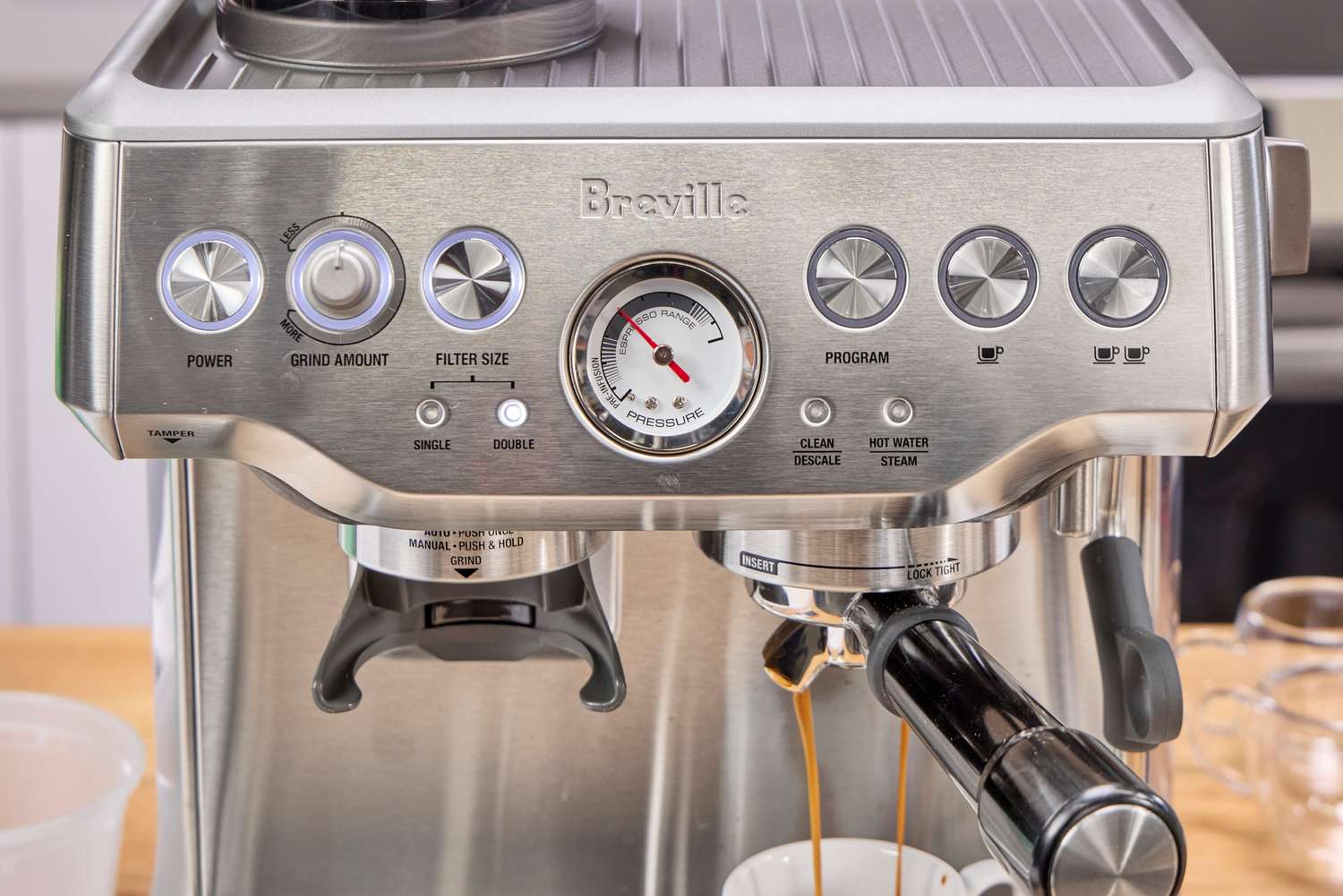The buttons and controls on the front of the Breville The Barista Express Espresso Machine