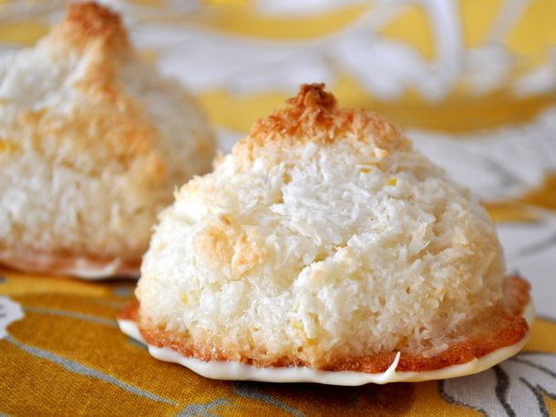 Closeup of white chocolate dipped lemon macaroons.