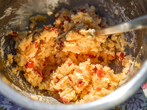 The potato-pimento cheese filling is mixed in a bowl.