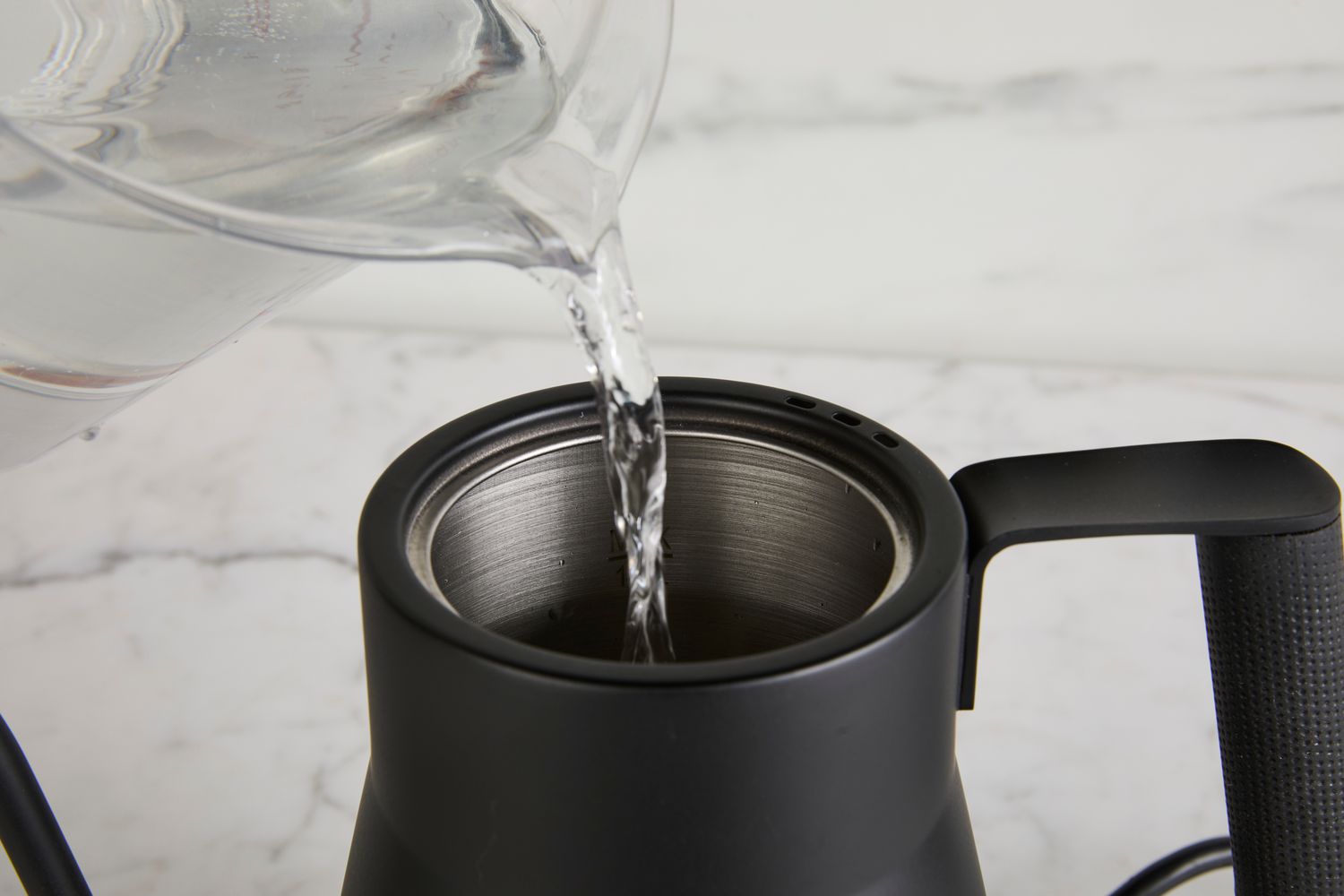 Water being poured into Saki Baristan Electric Gooseneck Kettle