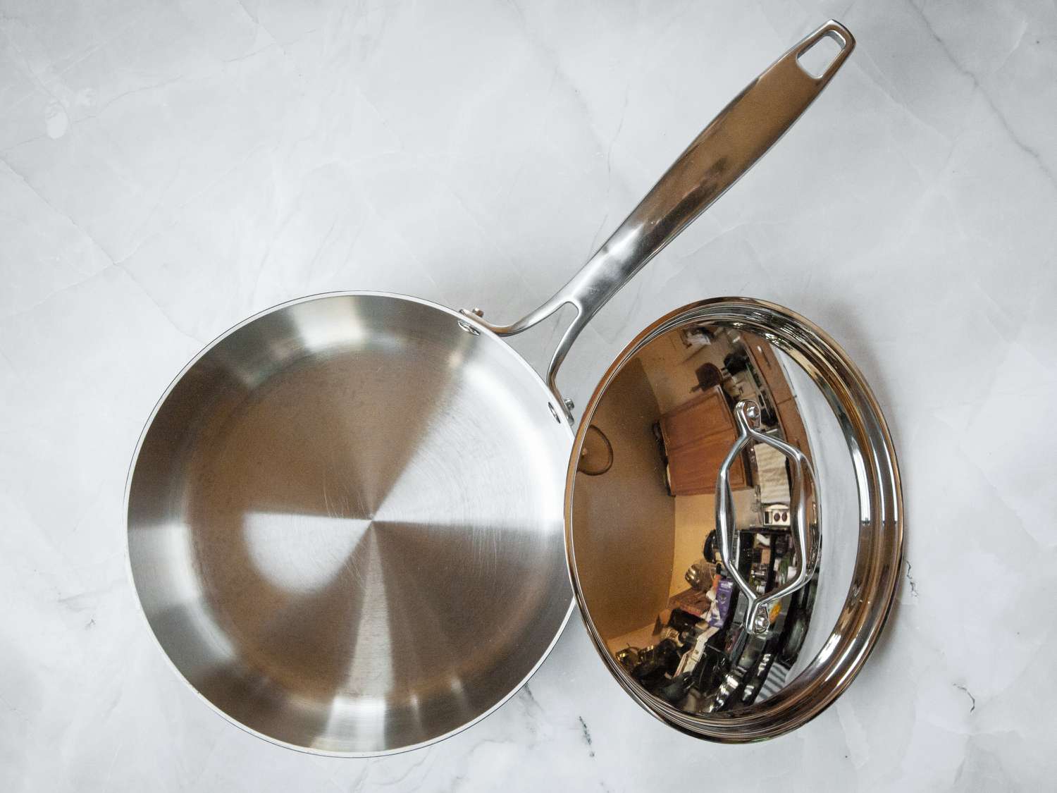 The Tramontina saucepan with its lid beside it.