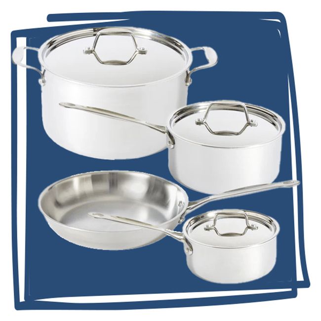 A set of four stainless steel pots and pans placed against a blue background