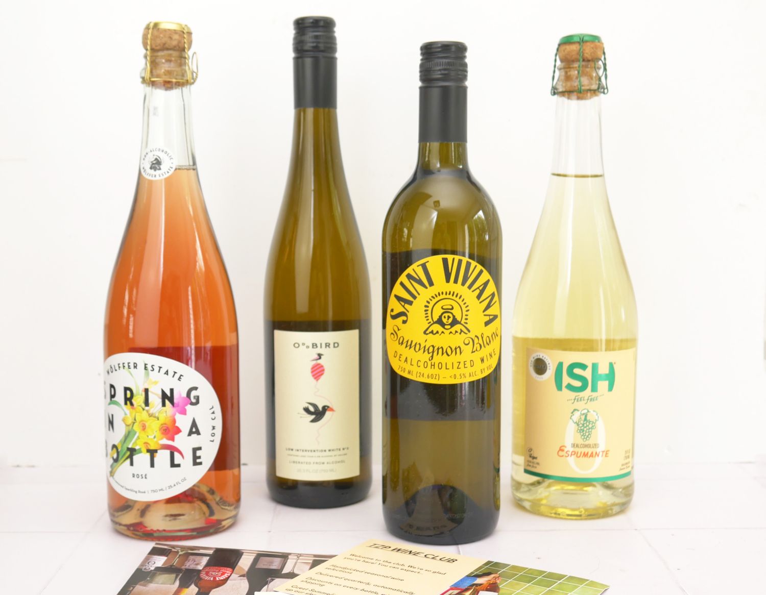 four bottles of NA wine