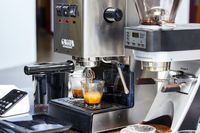 Two espresso cups being filled by the Gaggia Classic Pro Espresso Machine