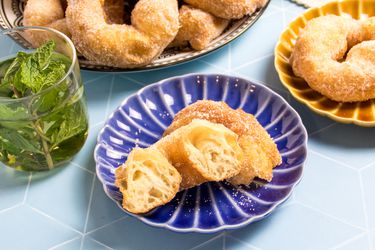Moroccan donuts with a glass of mint tea on a table