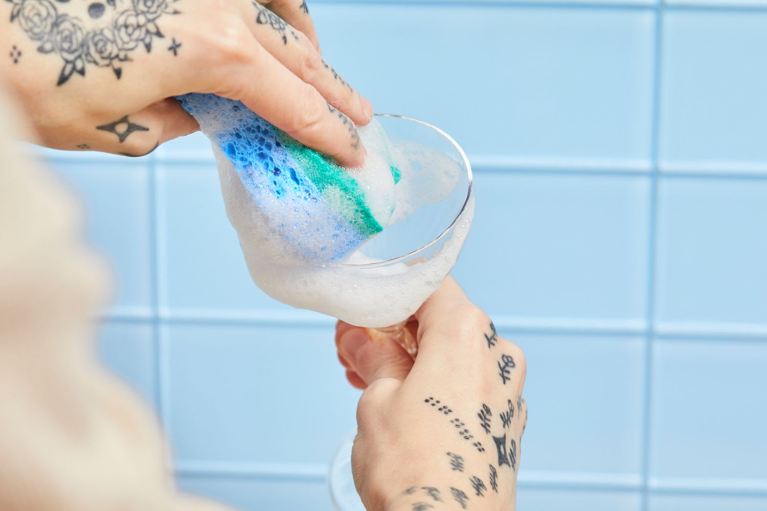 Person cleaning Bormioli Rocco America ’20s Glasses