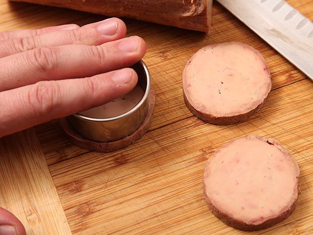 Punching round circles from foie gras torchon.