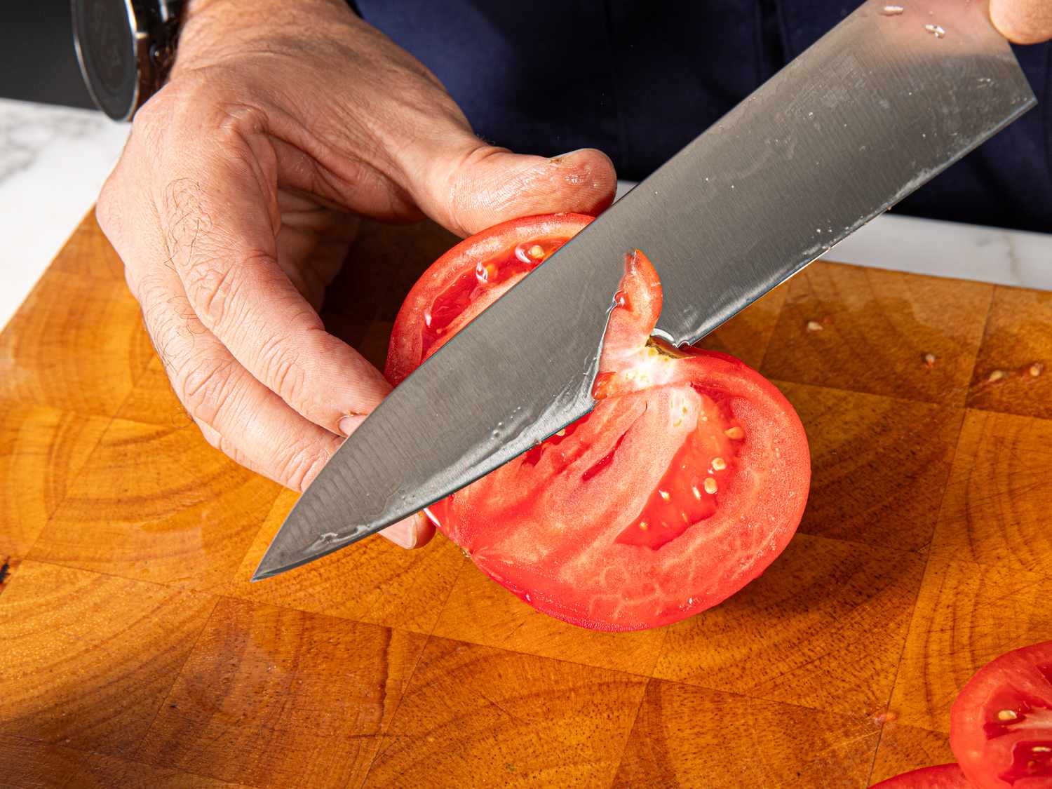 Cutting out core of tomato