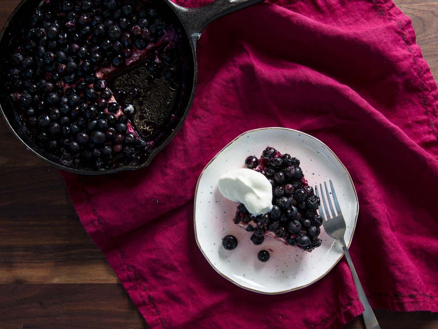 overhead view of broiled blueberries with cream cheese and graham cracker crust