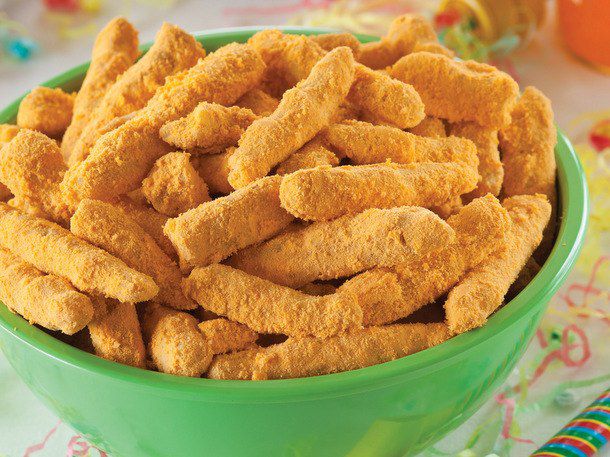 A green bowl filled with homemade cheetos.