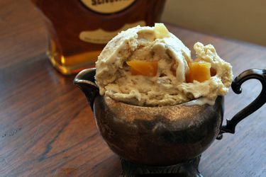 Lemon, Honey, and Brandy (or Guggle Muggle) Ice Cream, served in a pewter cream pitcher. A bottle of Slivovitz brandy is in the background.