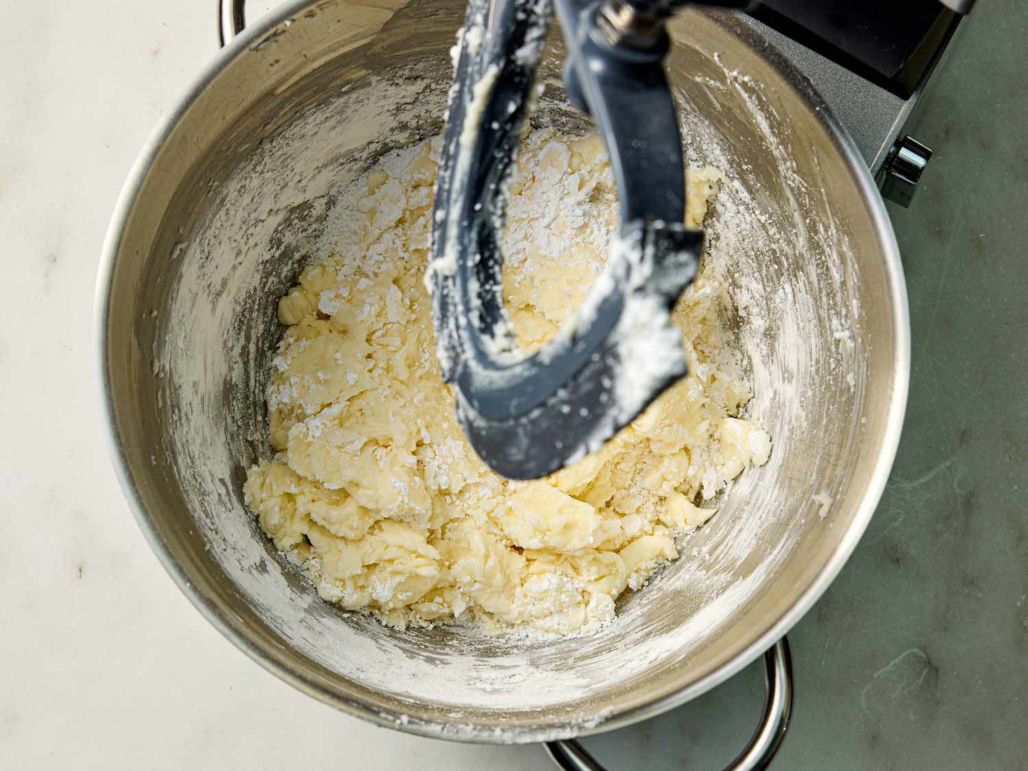 Cream cheese topping mixing in a bowl of stand mixer