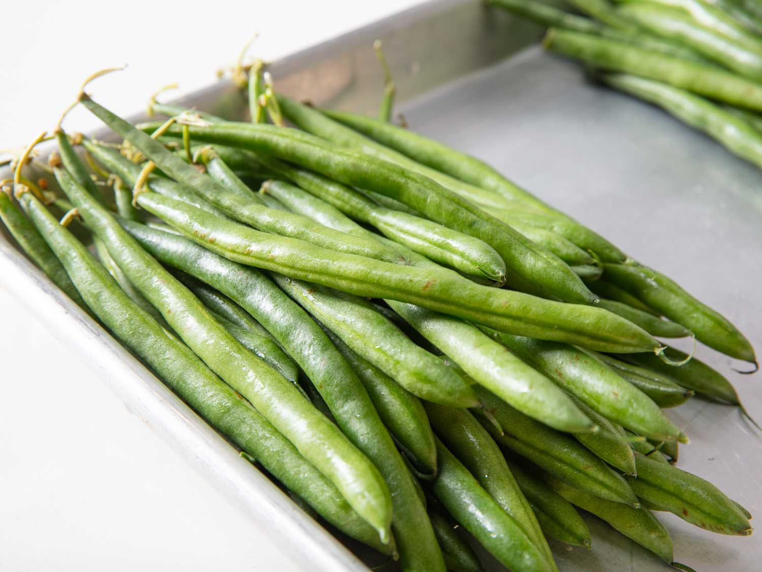 Closeup of whole raw green beans.