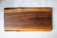 The Boardsmith charcuterie board on a marble countertop.