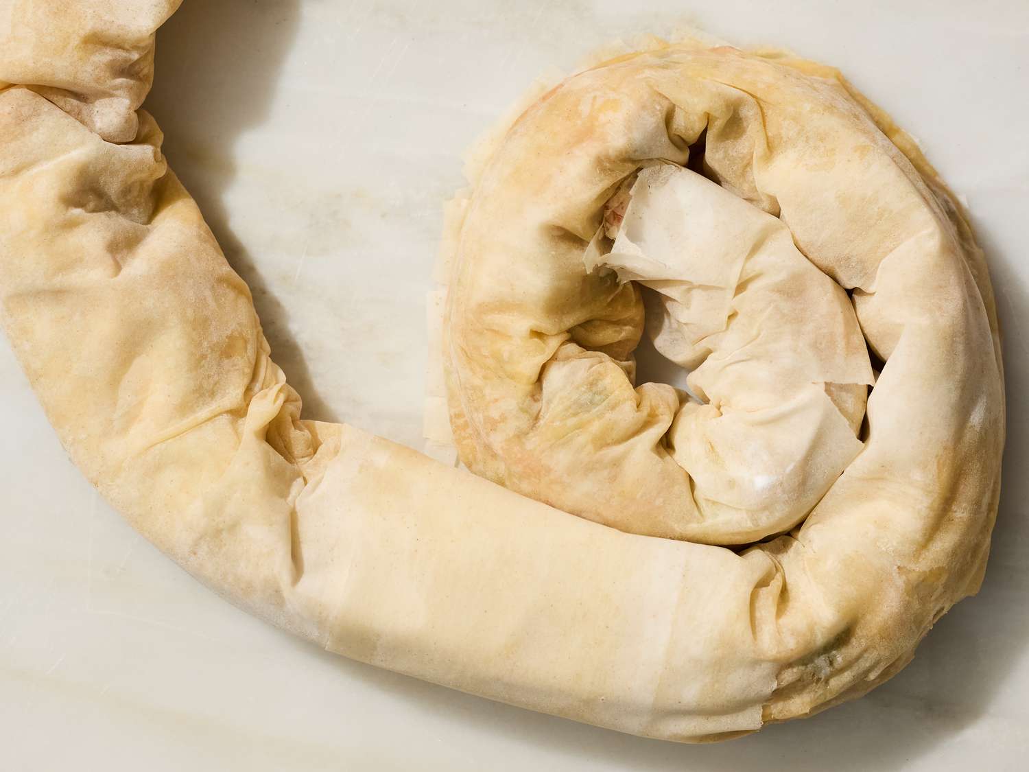 Rolled pastry dough shaped into a spiral