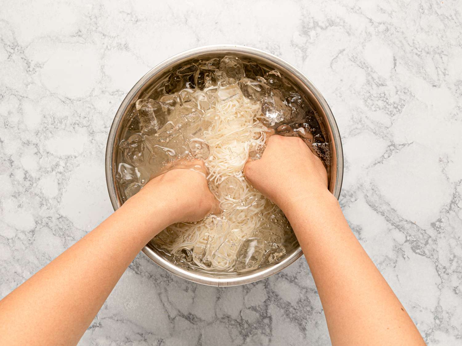 Overhead of noodles in ice bath