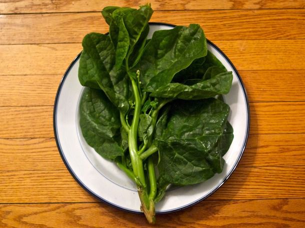 Malabar spinach resting on a plate