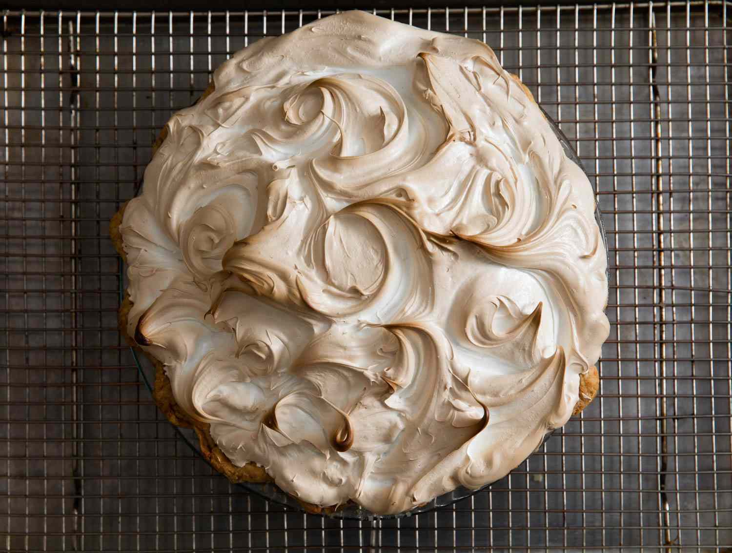 Overhead shot of the finished pie. The meringue is lightly browned along the swirled edges.