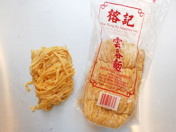 A package of Wide Wonton Noodles with one pile out of the bag