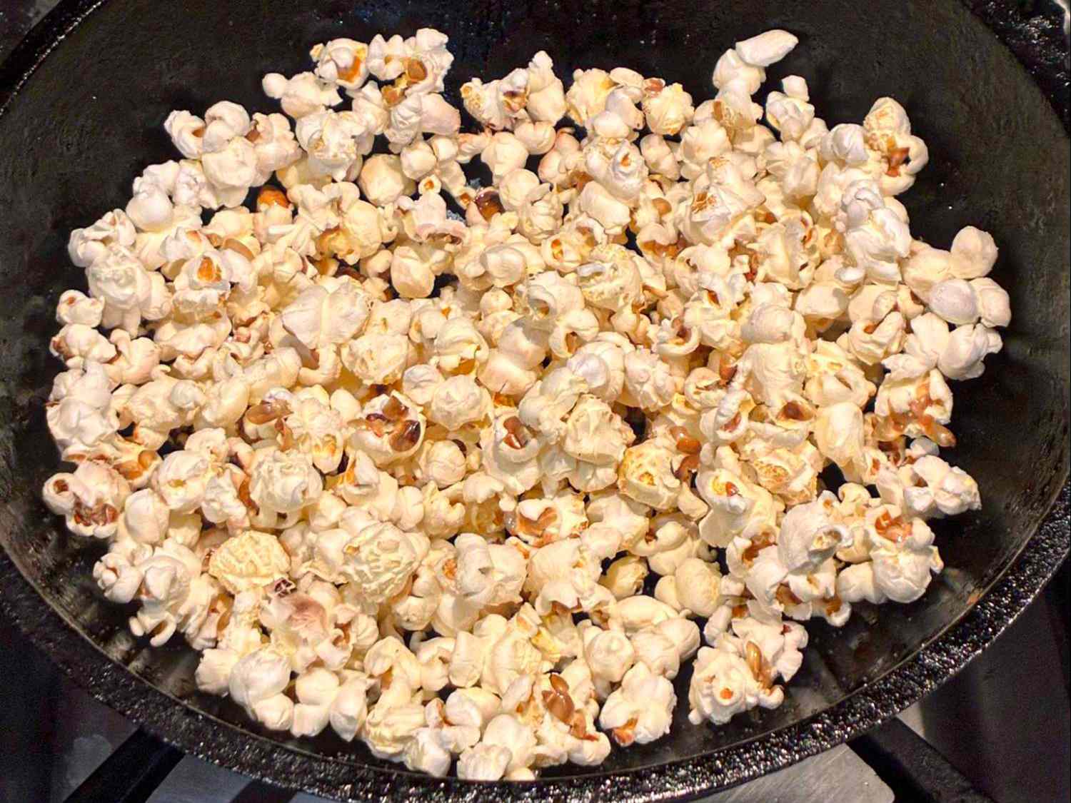 Popcorn in a pan on a stove